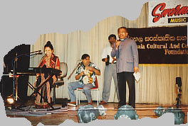 Karu and I sing a duet backed by the drummers and the tambourine player