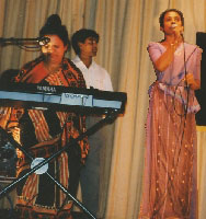 A Sri Lankan singer and musicians perform on stage.
