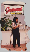 An adult student sings a patriotic song